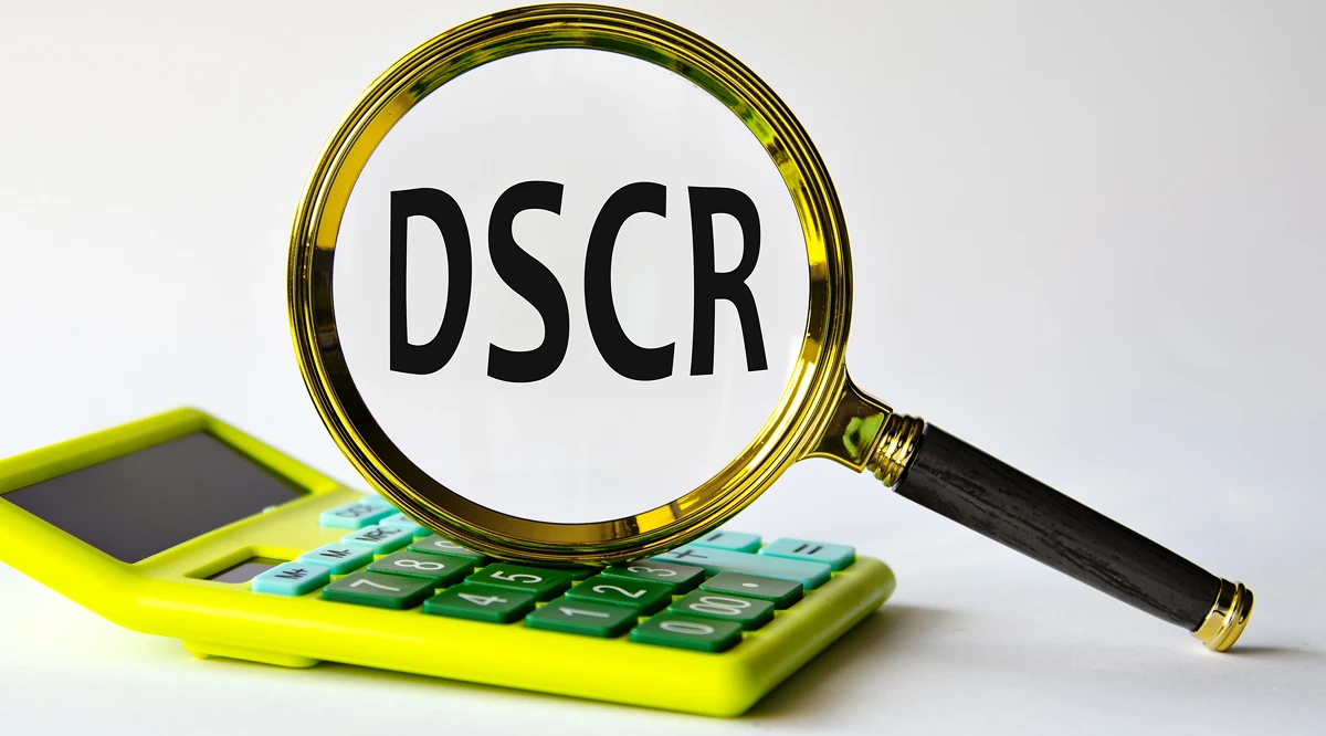 Magnifying glass over DSCR and calculator