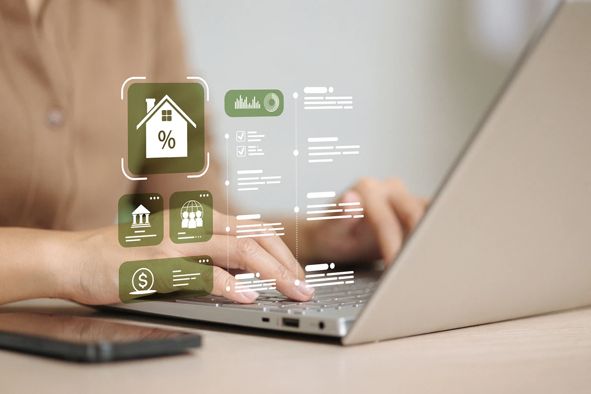 Person using laptop with financial graphics overlay