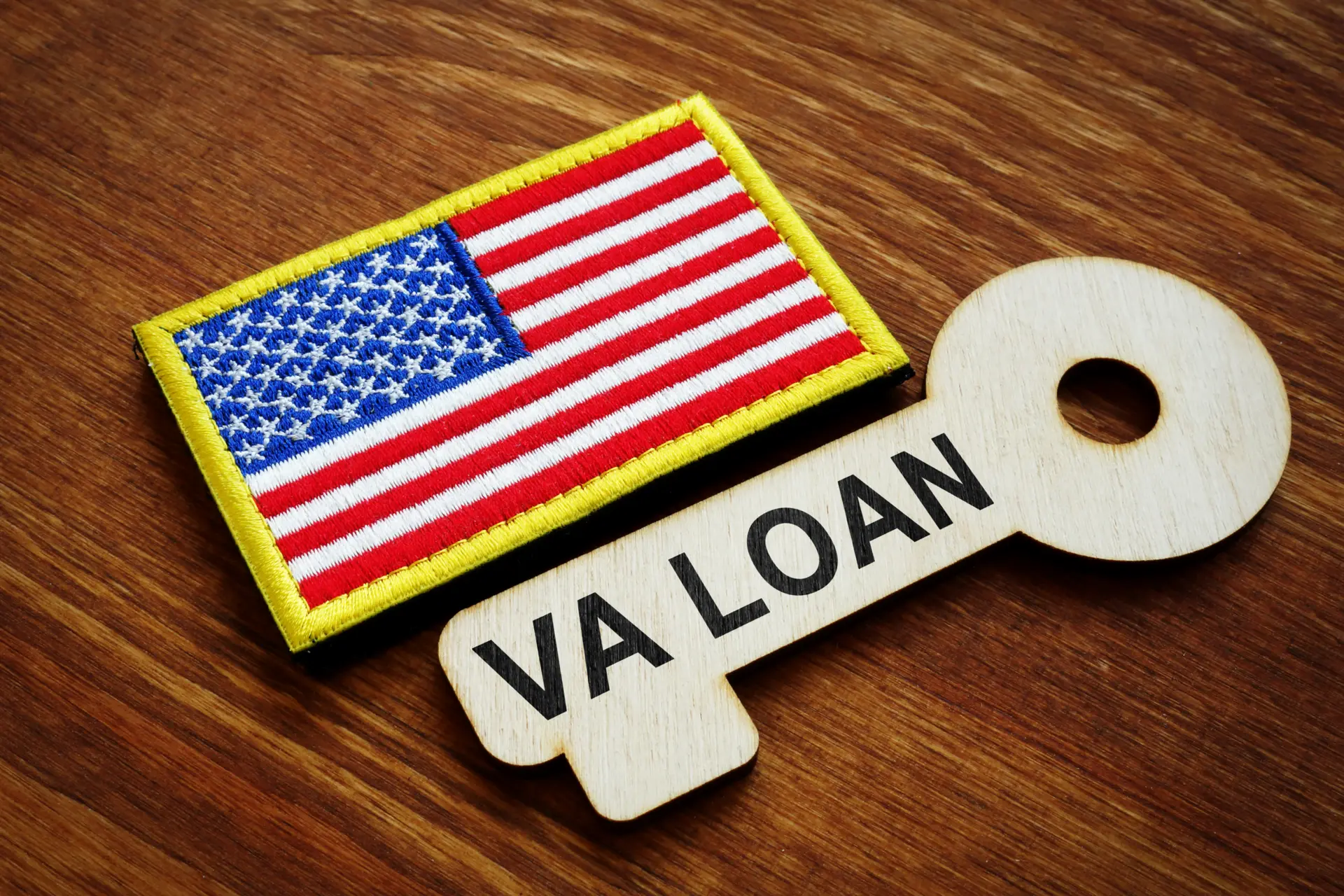 Wooden VA loan key and flag